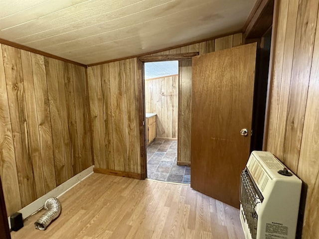 312 Pharr Ave, Selmer, TN 38375 - empty room with heating unit, wood walls, light wood-type flooring, lofted ceiling, and wooden ceiling