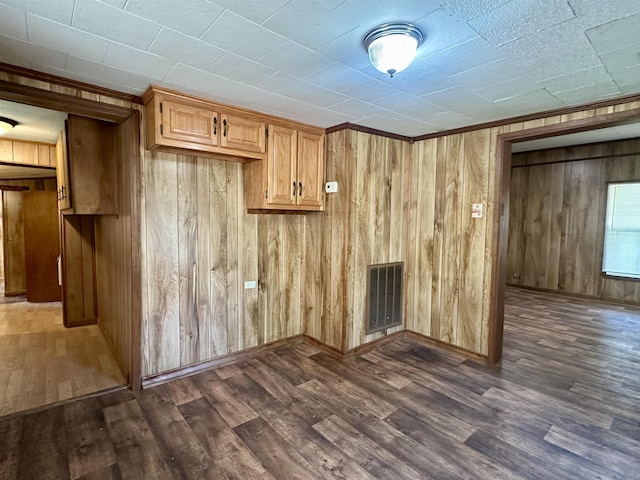 312 Pharr Ave, Selmer, TN 38375 - below grade area featuring dark wood finished floors and wood walls