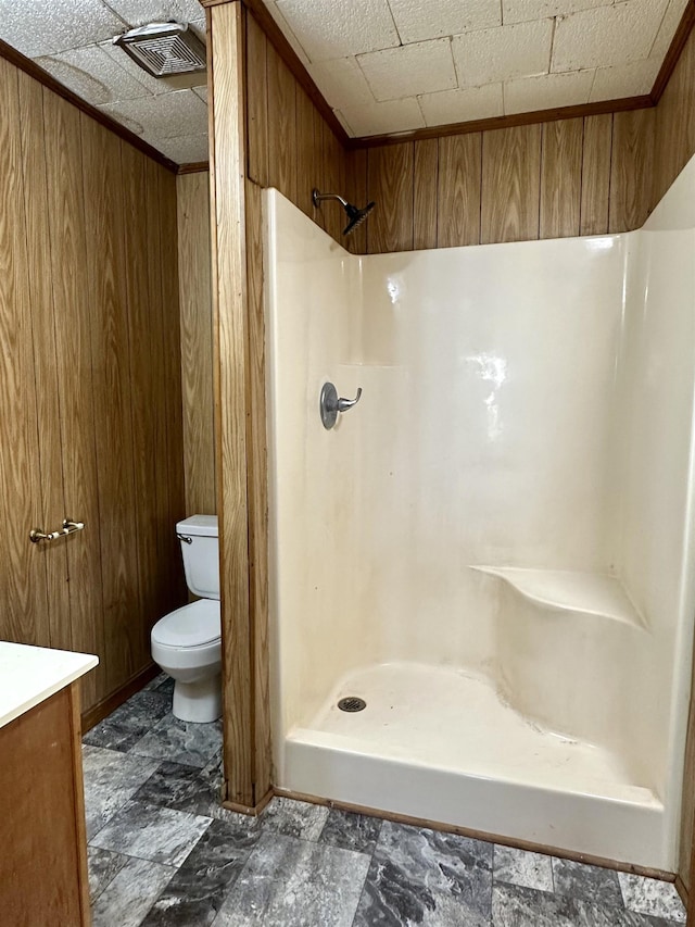 312 Pharr Ave, Selmer, TN 38375 - full bath featuring a shower, wooden walls, and vanity