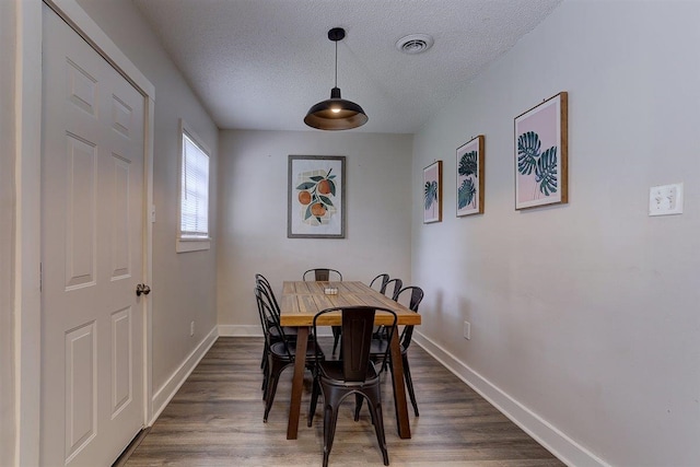 1680 Euclid Ave, Memphis, TN 38114 - dining room with a textured ceiling and dark wood-type flooring