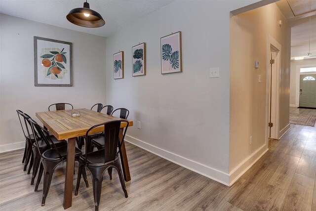 1680 Euclid Ave, Memphis, TN 38114 - dining room featuring light wood finished floors and attic access