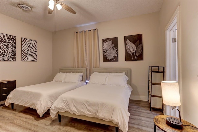 1680 Euclid Ave, Memphis, TN 38114 - bedroom featuring wood finished floors and a textured ceiling