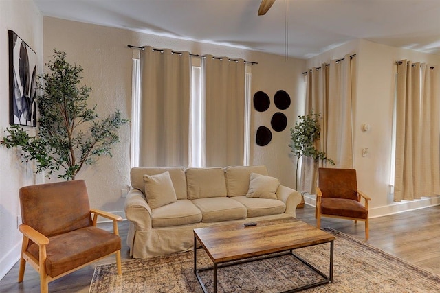 1680 Euclid Ave, Memphis, TN 38114 - living room featuring wood finished floors, a textured wall, and ceiling fan