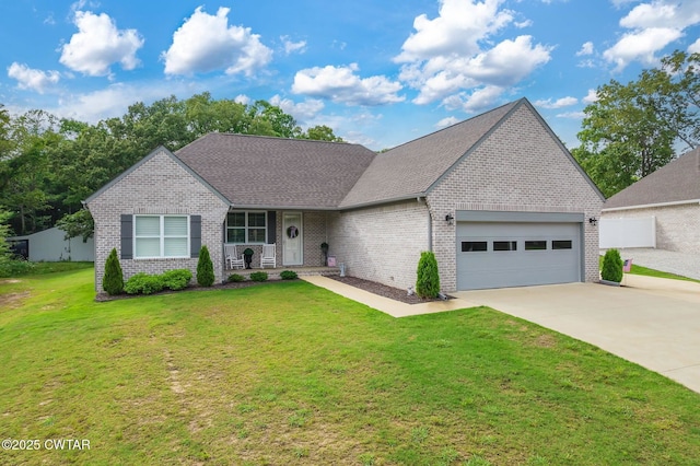 571 Todd Ray Cv, Henderson, TN 38340 - view of front of home with an attached garage, a porch, brick siding, driveway, and a front yard