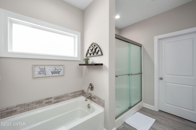 571 Todd Ray Cv, Henderson, TN 38340 - full bath with a garden tub, a shower stall, and wood finished floors