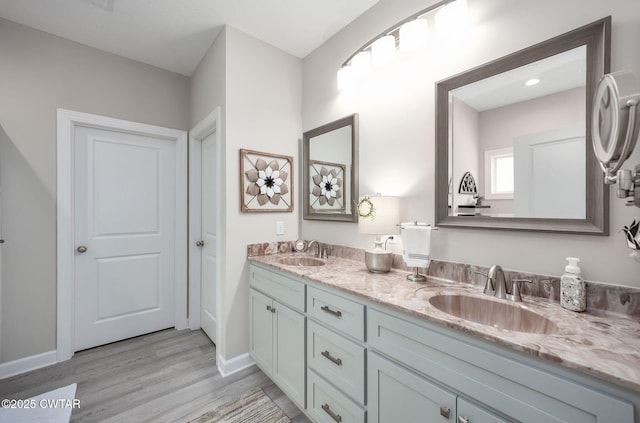 571 Todd Ray Cv, Henderson, TN 38340 - bathroom with double vanity and wood finished floors