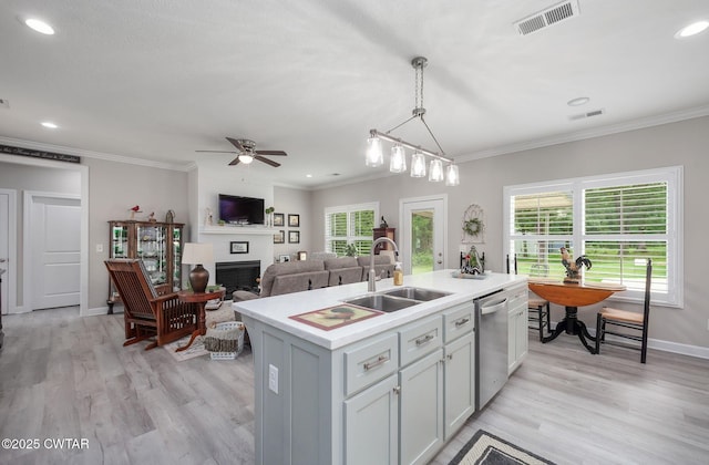 571 Todd Ray Cv, Henderson, TN 38340 - kitchen with dishwasher, plenty of natural light, a fireplace, light wood-style flooring, and ornamental molding