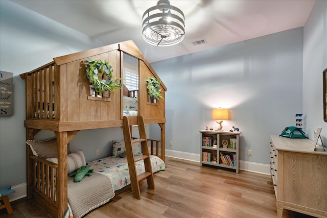 4342 Robinson Loop, Olive Branch, MS 38654 - bedroom with light wood-style floors, vaulted ceiling, and a chandelier