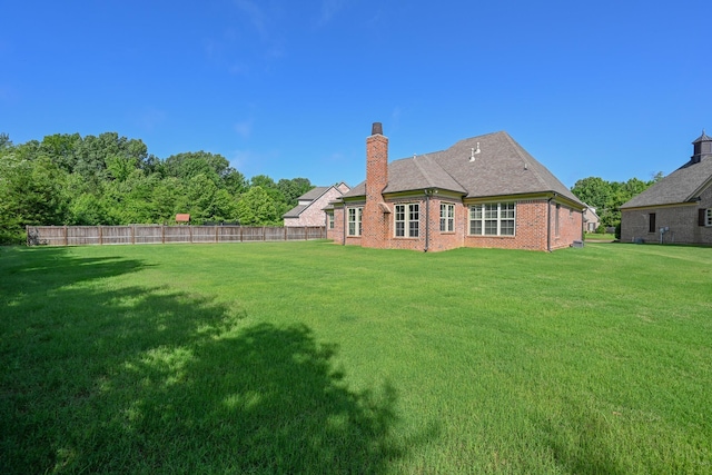4342 Robinson Loop, Olive Branch, MS 38654 - back of house with a chimney and brick siding
