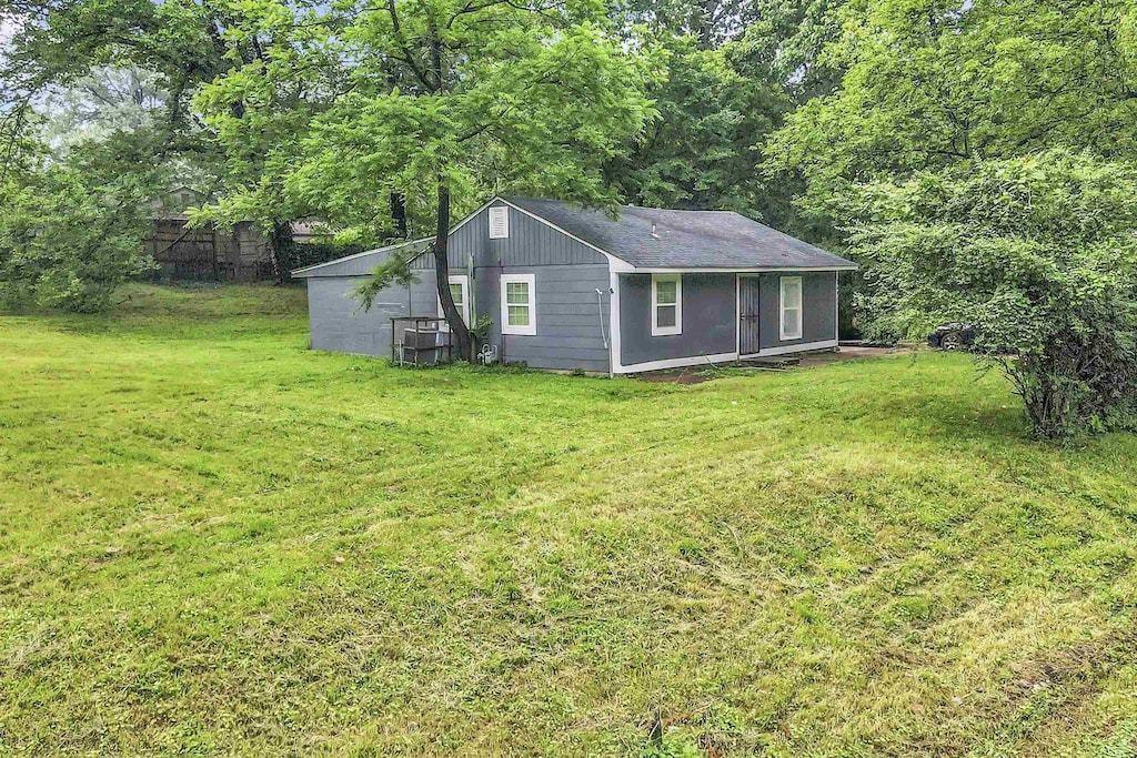 3696 Randolph St, Memphis, TN 38127 - view of home's exterior featuring a lawn