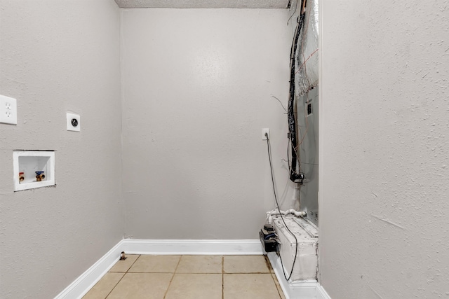 1017 Creston Ave, Memphis, TN 38127 - laundry room featuring hookup for an electric dryer, light tile patterned floors, and washer hookup
