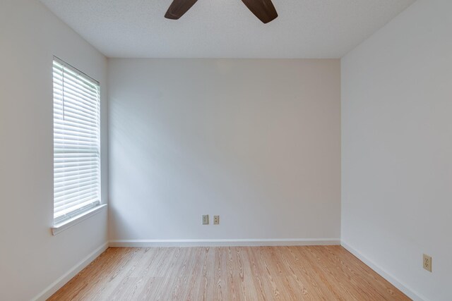 992 Zenith Cv N, Unicorp/Memphis, TN 38018 - spare room featuring light wood-style floors, healthy amount of natural light, and a ceiling fan