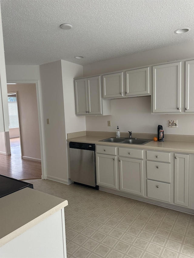 992 Zenith Cv N, Unicorp/Memphis, TN 38018 - kitchen with dishwasher, a textured ceiling, light countertops, and light floors
