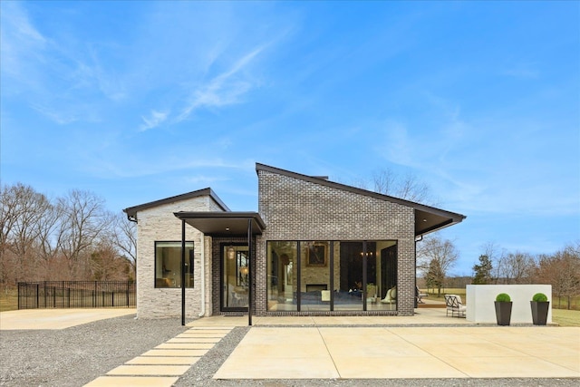 2270 Price Rd, Moscow, TN 38057 - rear view of house featuring brick siding and a patio area