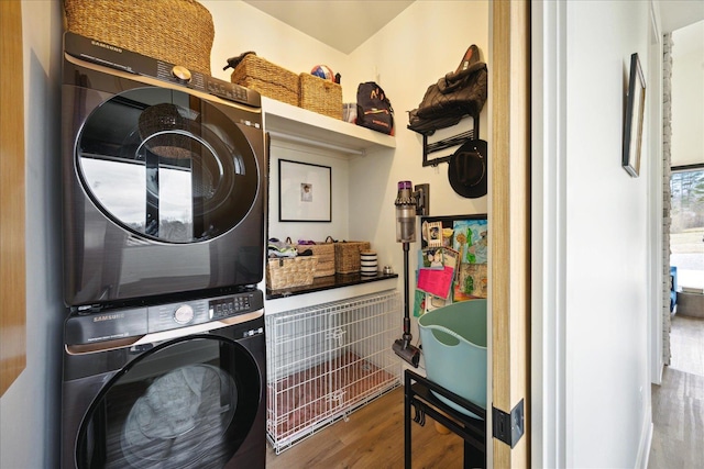 2270 Price Rd, Moscow, TN 38057 - laundry room featuring stacked washer / drying machine and wood finished floors