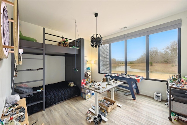 2270 Price Rd, Moscow, TN 38057 - bedroom featuring wood finished floors and a water view