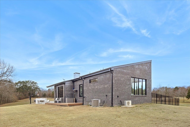 2270 Price Rd, Moscow, TN 38057 - rear view of house with a chimney, brick siding, and a deck