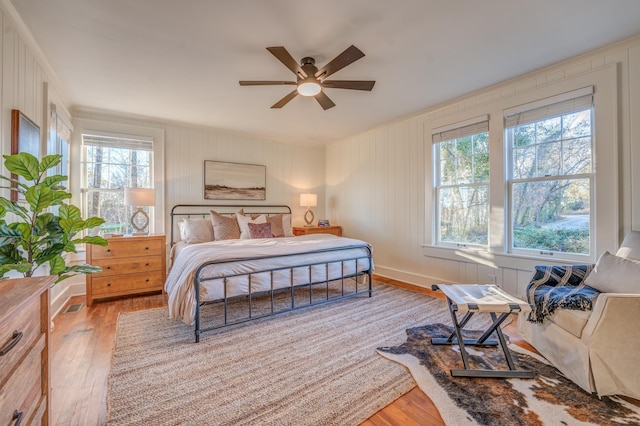 4950 Yum Yum Rd, Somerville, TN 38068 - bedroom with multiple windows, wood finished floors, and ceiling fan