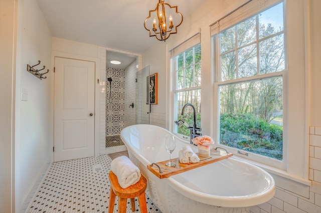 4950 Yum Yum Rd, Somerville, TN 38068 - full bath with a tile shower, a chandelier, and a freestanding bath