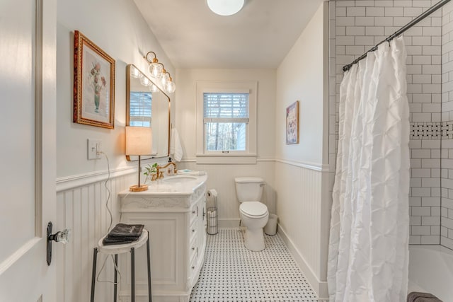 4950 Yum Yum Rd, Somerville, TN 38068 - full bathroom with vanity, a wainscoted wall, shower / bath combo with shower curtain, and tile patterned floors