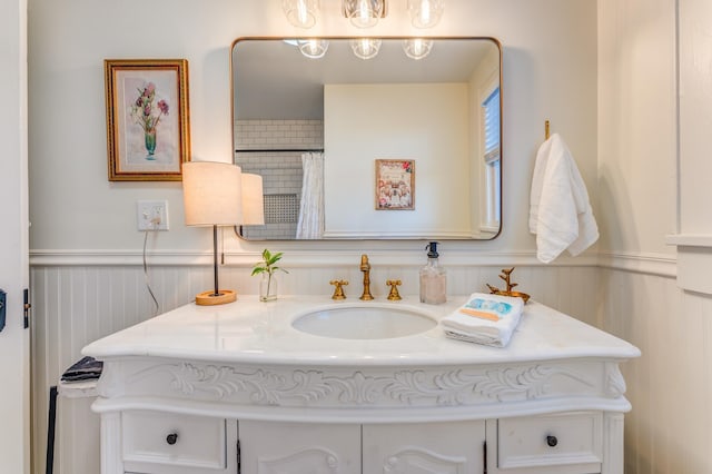 4950 Yum Yum Rd, Somerville, TN 38068 - full bathroom featuring vanity, wainscoting, a shower with shower curtain, and a decorative wall