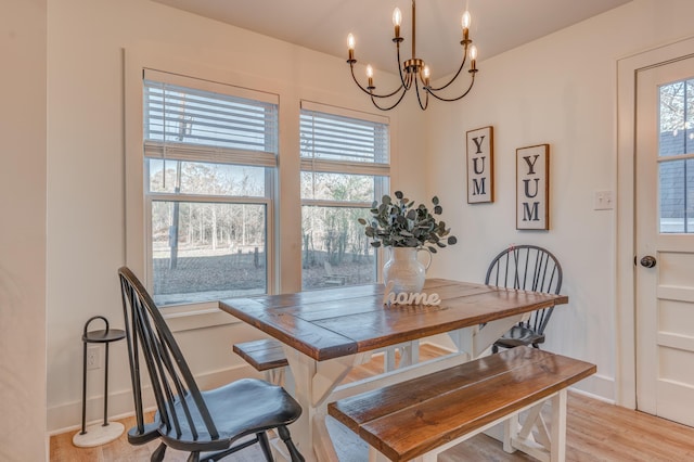4950 Yum Yum Rd, Somerville, TN 38068 - dining room featuring a chandelier, plenty of natural light, and light wood-style floors