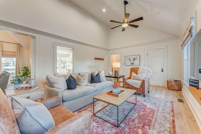 4950 Yum Yum Rd, Somerville, TN 38068 - living area featuring a ceiling fan, light wood-style floors, a decorative wall, and high vaulted ceiling