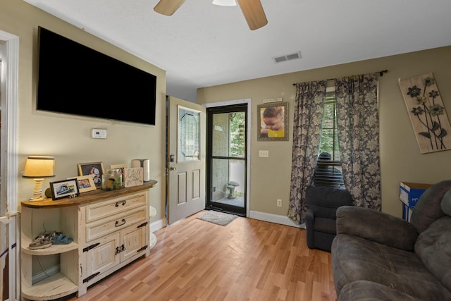 1635 Norton Rd, Middleton, TN 38052 - living room with light wood finished floors and ceiling fan