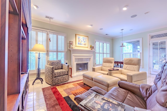 8799 Featherleigh Ln, Germantown, TN 38138 - living area featuring light tile patterned floors, plenty of natural light, ornamental molding, a tiled fireplace, and recessed lighting