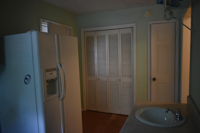101 Bob St, Selmer, TN 38375 - kitchen with white refrigerator with ice dispenser and wood finished floors