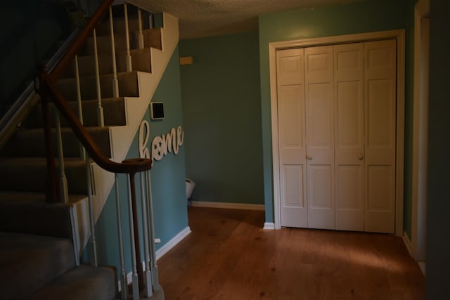 101 Bob St, Selmer, TN 38375 - staircase with wood finished floors and a textured ceiling