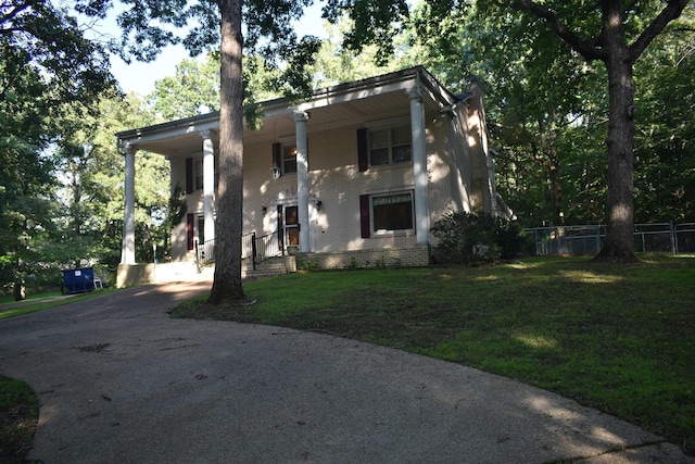 101 Bob St, Selmer, TN 38375 - greek revival inspired property with brick siding, driveway, and a porch