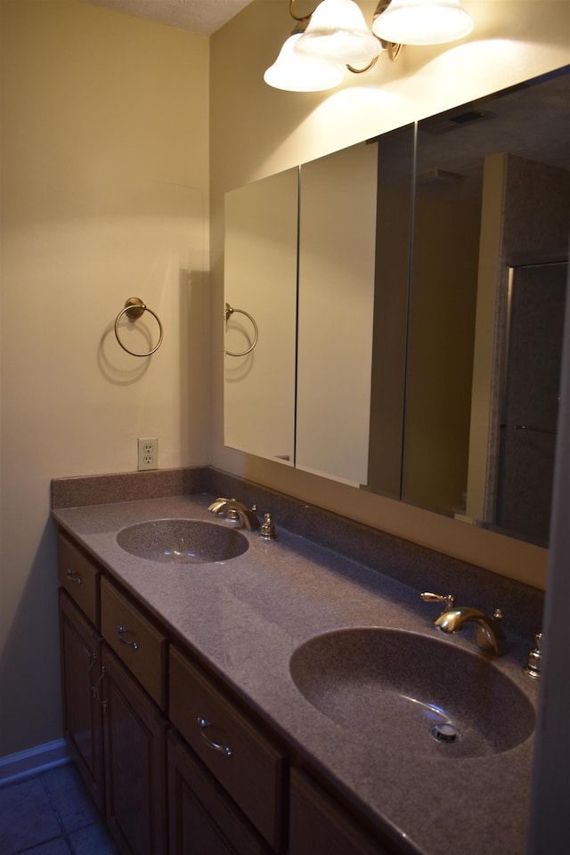 101 Bob St, Selmer, TN 38375 - bathroom with double vanity and tile patterned flooring