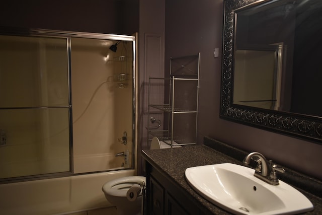 101 Bob St, Selmer, TN 38375 - bathroom featuring vanity and bath / shower combo with glass door