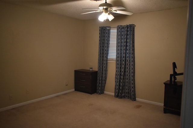 101 Bob St, Selmer, TN 38375 - unfurnished bedroom featuring light carpet, a textured ceiling, and ceiling fan