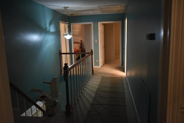 101 Bob St, Selmer, TN 38375 - hall with attic access, an upstairs landing, and carpet flooring