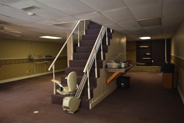 101 Bob St, Selmer, TN 38375 - finished below grade area featuring carpet flooring, a drop ceiling, and stairway