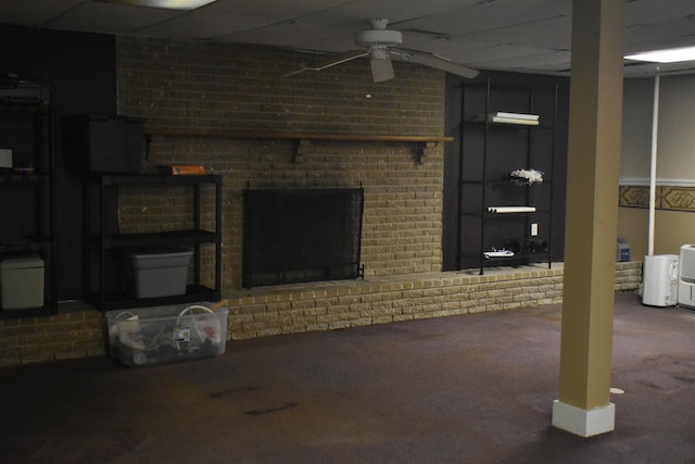 101 Bob St, Selmer, TN 38375 - basement featuring a ceiling fan, carpet, a drop ceiling, and a brick fireplace