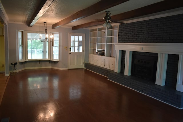 101 Bob St, Selmer, TN 38375 - unfurnished living room featuring ceiling fan, a chandelier, dark wood-style floors, a fireplace, and beam ceiling