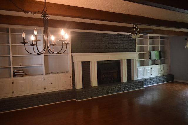101 Bob St, Selmer, TN 38375 - unfurnished living room with beamed ceiling, a ceiling fan, a brick fireplace, wood finished floors, and brick wall