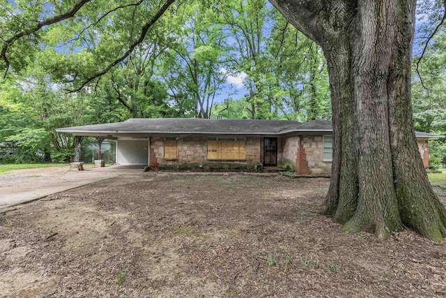 3205 E Shirley Cir, Memphis, TN 38127 - view of front of home featuring concrete driveway, a shingled roof, and a carport
