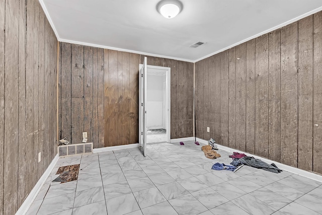 3205 E Shirley Cir, Memphis, TN 38127 - spare room featuring wood walls and ornamental molding