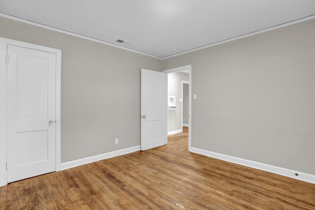3257 Millington Rd, Memphis, TN 38127 - empty room featuring crown molding and light wood-type flooring