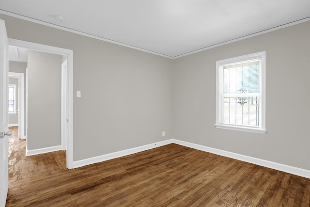 3257 Millington Rd, Memphis, TN 38127 - spare room with crown molding, dark wood-style floors, and plenty of natural light