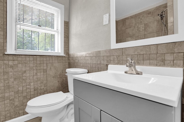 3257 Millington Rd, Memphis, TN 38127 - bathroom featuring tile walls, vanity, a wainscoted wall, and a shower