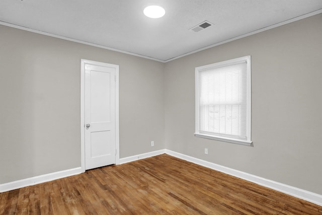 3257 Millington Rd, Memphis, TN 38127 - spare room featuring crown molding and wood finished floors