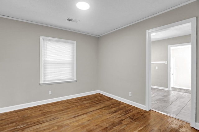 3257 Millington Rd, Memphis, TN 38127 - empty room featuring crown molding and wood finished floors