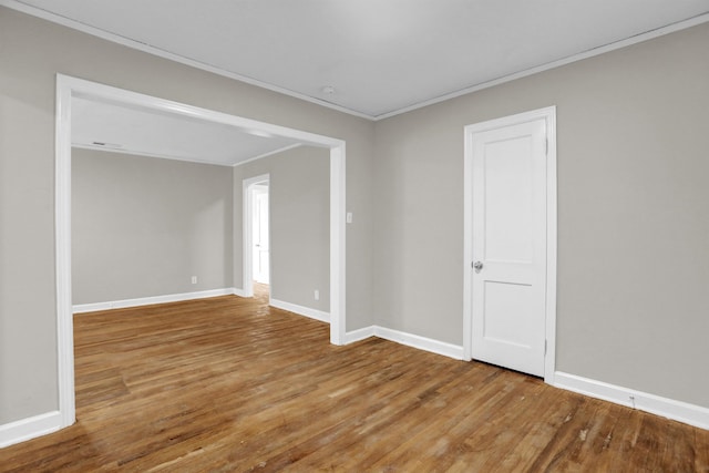 3257 Millington Rd, Memphis, TN 38127 - spare room with crown molding and wood finished floors