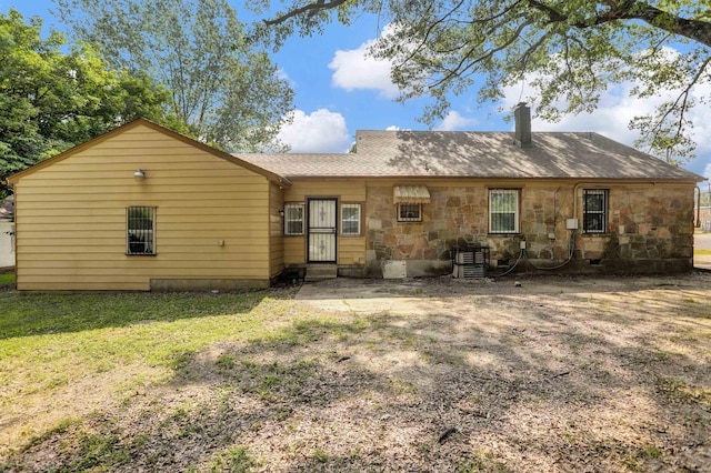 3257 Millington Rd, Memphis, TN 38127 - back of property with a chimney, a lawn, and stone siding