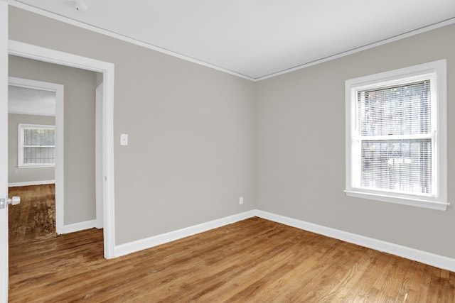 3257 Millington Rd, Memphis, TN 38127 - spare room featuring light wood-style flooring and ornamental molding
